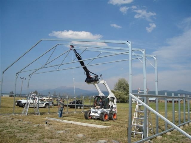 Tele-Boom helping set metal rafters.